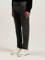 Front view of Palm Angels Curved Logo Denim Jeans in Black