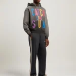 Model wearing Palm Angels Catch Some Sun Hoodie outdoors