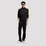 Model wearing Palm Angels Classic Logo Track Pants styled with sneakers