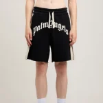 Model wearing Palm Angels Curved Logo Track Sweatshorts front styling